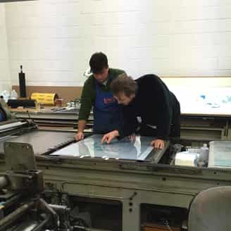 Michael Williams working with Steven Fournier on a lithograph.