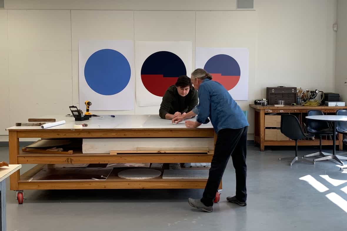 Bruce Wankel and Steven Fournier working on Carmen Herrera’s “Tondo: Azul y Rojo,” 2019