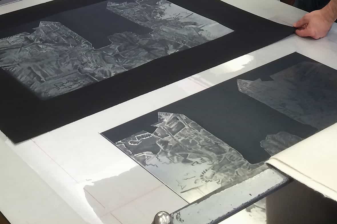An etching plate and pulled print resting on an etching press for Jasper Johns "Regrets," 2014 edition of 19.